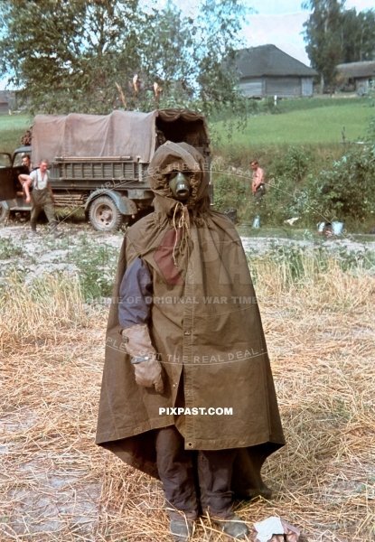 Hauptmann Heinz Jarmer dressed in zeltbahn jacket with gas-mask and gloves in Russia 1941. 3. Panzer Brigade. 3RD Panzer