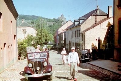 Italian Fiat Balilla 1937 cabrio at Shell Petrol station in Saarburg Germany 1937. Saarburg Castle behind the Moselle river.