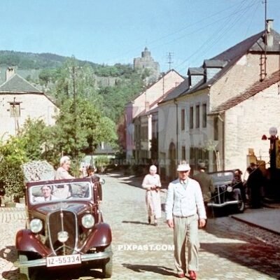 Italian Fiat Balilla 1937 cabrio at Shell Petrol station in Saarburg Germany 1937. Saarburg Castle behind the Moselle river.