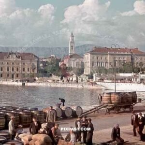 KDF German Ship in Yugoslavian Harbour 1939. Men unloading barrels of wine. Ice cream seller.