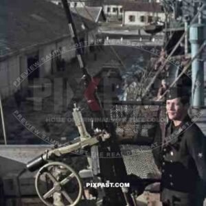 Kriegsmarine sailor beside 20mm Flak AA cannon on german supply ship, Tunis, Tunisia 1942, Quai Transatlantique