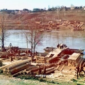 Large German Pioneer unit construction a new timber war bridge using pontoon boats across river Ukraine 1941