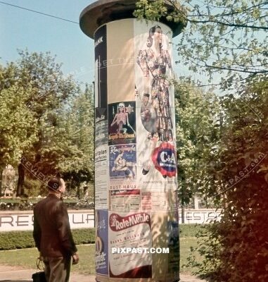 Large advertisement Litfasssaule column in Berlin city Germany June 1939. C&A posters