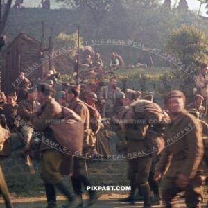 Large quantities of captured French military Prisoner of War. Guarded by German soldiers. France 1940