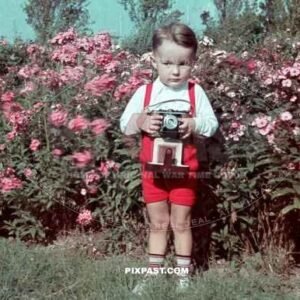 Little boy holding his fathers Certo Dollina I camera. Summer 1939 Halle Saale Germany.