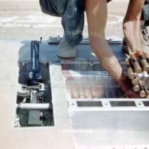 Loading ammunition into a Spitfire Mk V (trop) WZ-J JL237. 309th Fighter Squadron of the 31st Fighter Group. Sicily 1943.