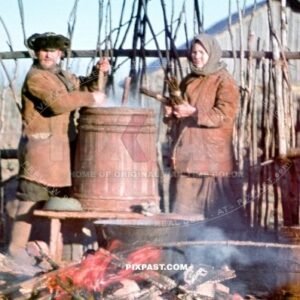 Local Russian farmers preparing warm soup over an open fire for their village on the outskirts of Smolensk Russia 1942