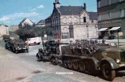 Luftwaffe Half-Track tows 88mm flak cannon pass Goldene Sieben Shop in Halle Salle Germany 1939