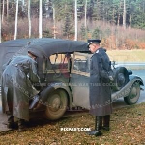 Luftwaffe driver pouring petrol into staff car on their way to Stuttgart on the autobahn. Germany 1940