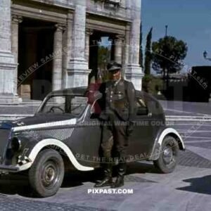 Luftwaffe flak officer of the Leichte Flak Abteilung 99 (mot) in Rome Italy 1944 with staff car.