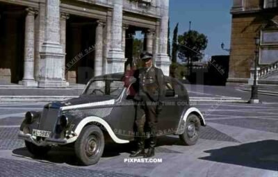 Luftwaffe flak officer of the Leichte Flak Abteilung 99 (mot) in Rome Italy 1944 with staff car.