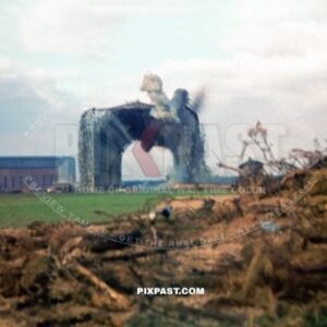 Luftwaffe ground crew demolishing old Zeppelin Hall in France 1942. Airfield was for the Jagdgeschwader 2 Richthofen.