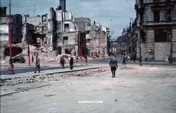 Luftwaffe officer Bindewald in destroyed bombed city town Krakow Poland 1940.