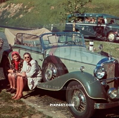Mercedes-Benz 380 Cabriolet B, Kelheim Germany 1939, with tour bus behind and family resting beside road.
