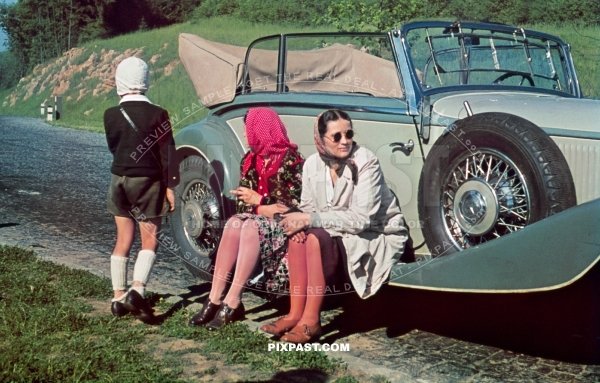 Mercedes-Benz 380 Cabriolet B, Kelheim Germany 1939, with tour bus behind and family resting beside road.