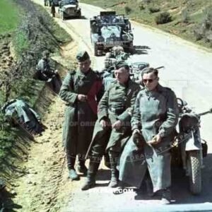 Motorbike messengers rest on dusty road, Russia 1941