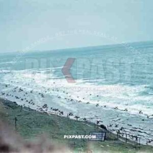 Normandy Coast Beach. France 1944. Days before D-Day Invasion. German steel Hedgehogs and mine fields. MG position.