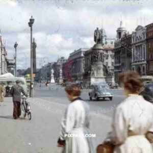 O_qt_Connell Street Dublin, Ireland, 1953, showing vintage cars and Nelson_qt_s pillar and Daniel O_qt_Connell Statue