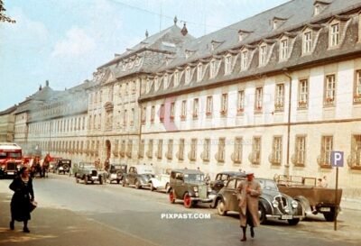 Old cars and bus parked in front of the Juliusspital Weingut Wurzburg Germany summer 1938