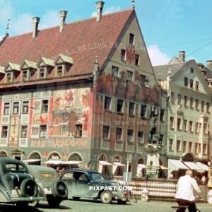 Old cars and tram in front of Weberhaus Maximiiliansttrasse Augsburg Germany summer 1938