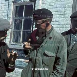 Panzer mechanic smoking cigarette in overalls talk to local Russians, Cherson, 1942, 22nd Panzer Division