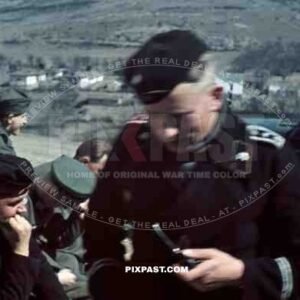 Panzer officer smoking pipe, staff meeting, Don, Rostow, July 1942, 22nd Panzer Division. PKW Horch 901.