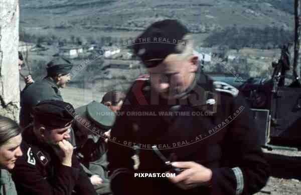 Panzer officer smoking pipe, staff meeting, Don, Rostow, July 1942, 22nd Panzer Division. PKW Horch 901.