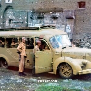 Paratrooper Fallschirmjager board Italian Alfa Romeo Autobus bus. yellow camouflage. Para Regiment 3. Rome Italy 1943
