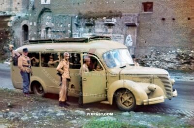 Paratrooper Fallschirmjager board Italian  Alfa Romeo Autobus bus. yellow camouflage. Para Regiment 3. Rome Italy 1943