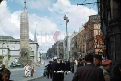 Parnell Square, Dublin, Ireland, 1953, Top of O Connell Street, Parnell Monument, old cars, shops, tourists,