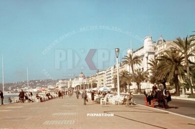 Promenade des Anglais in Nice, France Septmeber 1940. Civilian life with horse drawn wagon. Palmstreees