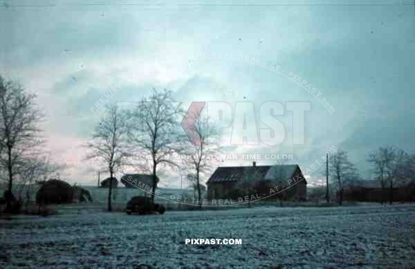 Russia Minsk, 1942, winter, snow Luftwaffe ground crew staff car beside Russian village,