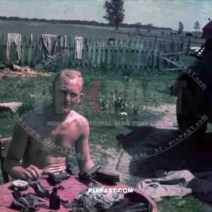 Russia summer 1941, 4th Panzer Division. Repairing staff car and cleaning Luger pistols.