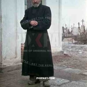 Russian Orthodox priest in front of Church and graveyard, Russia 1942, Taken by German war reporter.