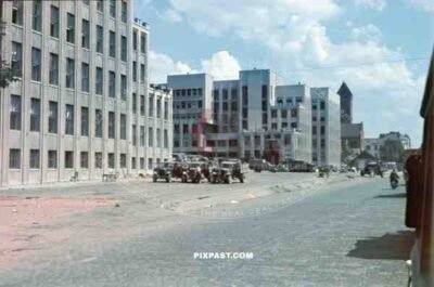 Russian captured truck park.  Ulitsa Sovetskaya Street. Minsk, Belarus. 1941. Church of Saints Simon and Helena.