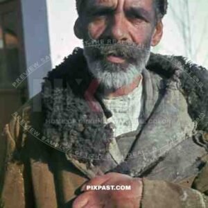 Russian farmer in traditional hat and winter jacket, Russian front. 1944.