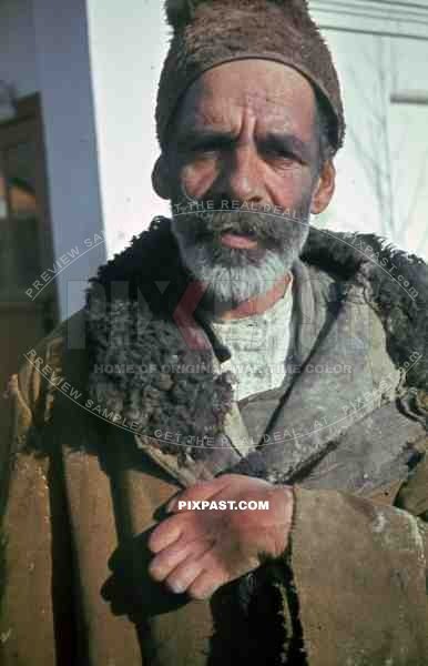 Russian farmer in traditional hat and winter jacket, Russian front. 1944.
