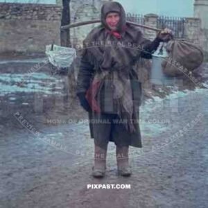 Russian farmer women carrying food and water through Russian village 1943. Photographed by german war photographer.