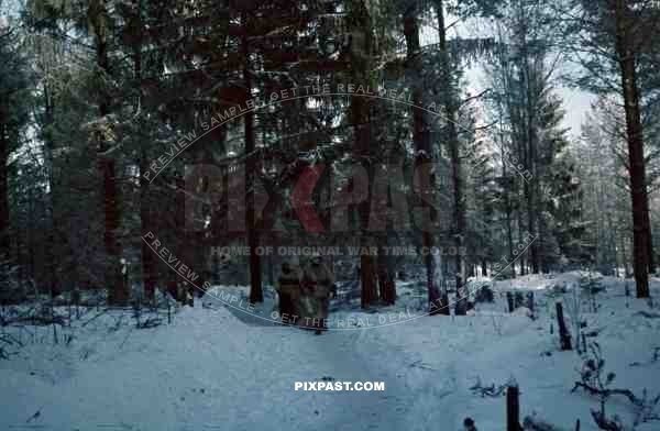 Russian forest, winter snow 1943 Russia, German infantry in white snow camo uniform and helmets, 207th Infantry Division