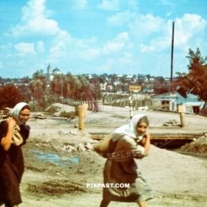 Russian women carry sacks of potatoes on the outskirts of Smolensk Russia September 1941. Nikolajewka