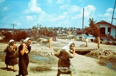 Russian women carry sacks of potatoes on the outskirts of Smolensk Russia September 1941. Nikolajewka