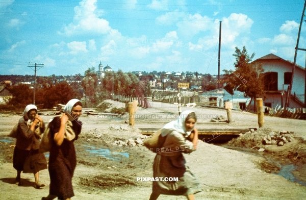 Russian women carry sacks of potatoes on the outskirts of Smolensk Russia September 1941. Nikolajewka
