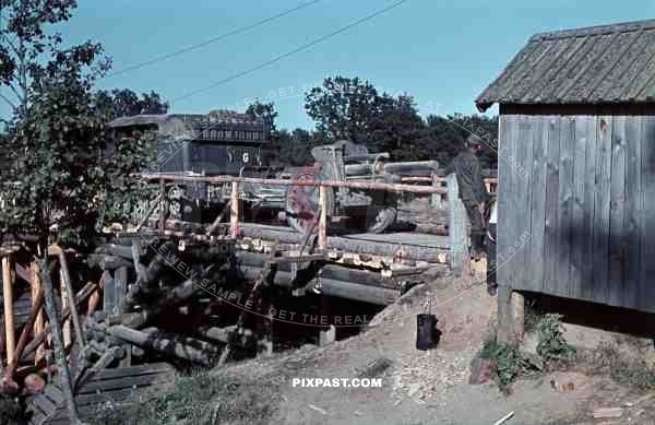 SdKfz 6 half-track with 10.5 cm leFH 18 Artillery Cannon over wooden war bridge, 3rd Panzer Division, Beresina 1941.