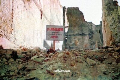 Sign post for La Chemisereie Moderne 18 Rue Bannier Orleans France 20.6. 1940. Bombed fashion shop. Ruins.