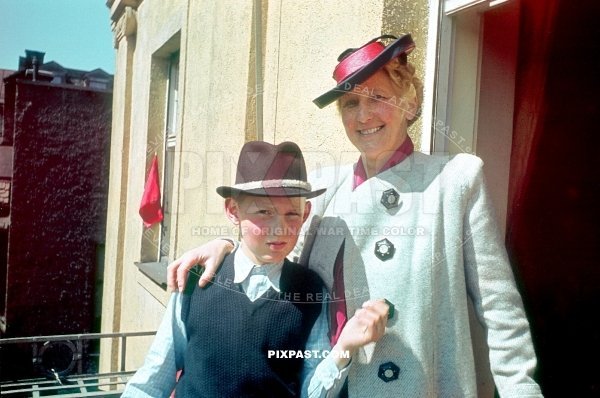 Son and his mother standing on balcony looking at the army preparation for Hitlers Birthday army parade Munich 1939