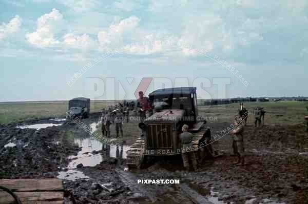 Soviet tractor S-65 used to pull out Wehrmacht trucks out of the mud, September 1941. Poltava, Donez, Ukraine.