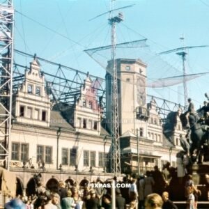 The Alte Rathaus in Markt Leipzig 1945. Children climbing on the Kaiser Siegesdenkmal and watching a circus performance