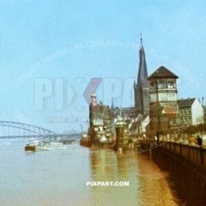 The Rhine bridge in Dusseldorf in west Germany NRW. Germany 1942. Luftschutz bunker yellow sign. Schlossturm.