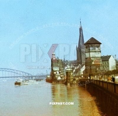 The Rhine bridge in Dusseldorf in west Germany NRW. Germany 1942. Luftschutz bunker yellow sign. Schlossturm.