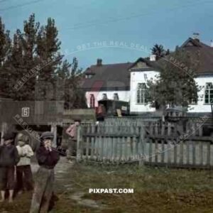 Tokari, Ukraine, 1941, Primary School. Children playing beside German army supply truck. 94. Infantry Division.